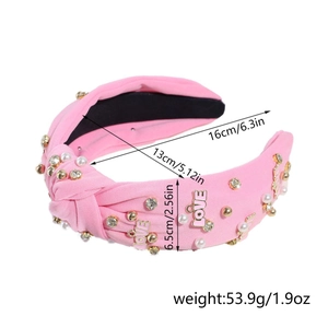 Pink knotted headband with pearls and rhinestones showing 16cm and 6.5cm dimensions