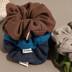 Knitted wool scrunchies in Morandi colors with Happiness label for winter hairstyles