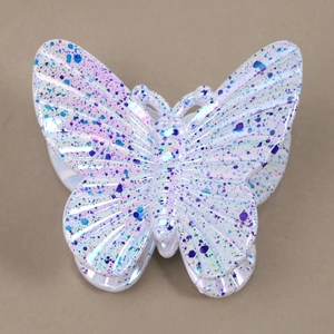 Detail of butterfly hair claw clip with colorful ink splash and iridescent pearl finish