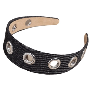 Wide denim headband with metallic silver eyelets in a punk style fashion accessory