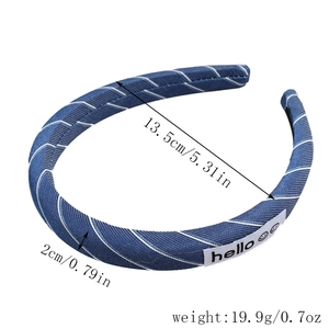Detailed view of blue striped fabric headband with dimension arrows and product weight