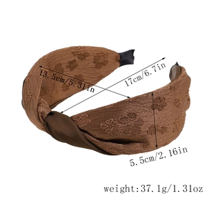 Vue détaillée du bandeau en tissu floral marron avec dimensions 17x13,5 cm et nœud