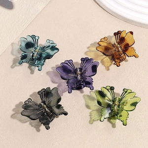 Five 3D butterfly hair claws in assorted translucent colors including blue and purple