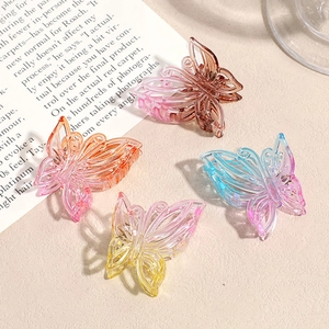 Lot de quatre pinces à cheveux papillon évidées en résine dégradée pour coiffures femme