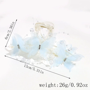 Detail of 13cm light blue butterfly hair claw clip with pearls and rhinestones