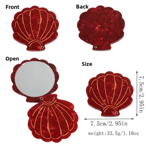 Detailed shell-shaped acetate makeup mirror in red marble pattern with size dimensions