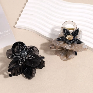 Mesh flower hair claw clips in black and champagne gold with sparkling rhinestones