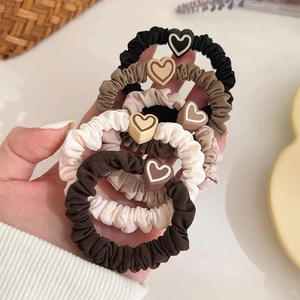 Set of five elastic heart scrunchies in minimalist neutral tones for women