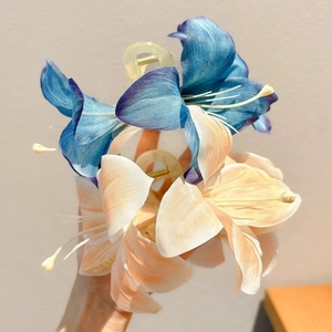 3D lily flower hair claw clips in blue and champagne silk fabric for elegant hairstyling