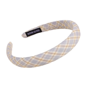 Minimalist plaid fabric headband in light grey and yellow with Hand Made label