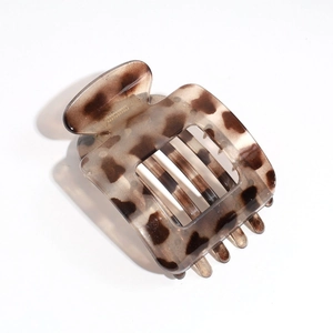 Detail of a large square hair claw clip with a classic brown leopard tortoise pattern