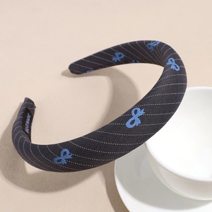 Elegant navy stripe headband with blue embroidery and handmade label detail