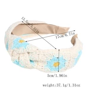Detail showing knit floral pattern and dimensions on this cream crochet headband