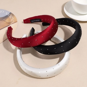 Elegant satin padded headband set with sparkling rhinestones in red, black, and white