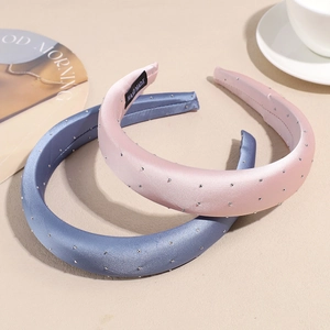 Padded satin headbands with rhinestones in pink and blue for elegant hair styling
