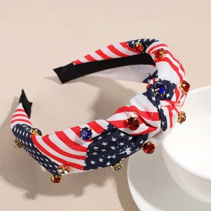Close-up of patriotic American flag headband with sparkling red, blue, and white rhinestones