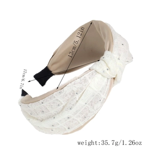 Close-up of knotted lace headband with silver rhinestones and dimensional measurements
