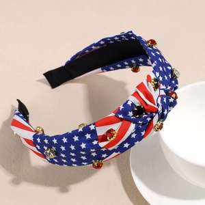 Detailed macro view of American flag knot headband with embedded sparkling rhinestones