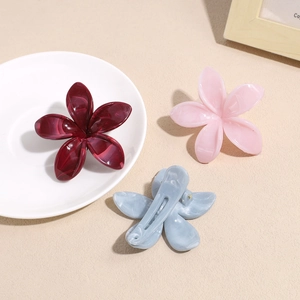 Three gradient floral hair claws in burgundy, pink and blue with marble texture