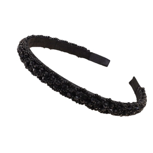 Elegant black padded headband embellished with shimmering crystal beads on a white backdrop