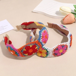 Bohemian knit floral headband with handmade crochet flowers in vibrant colors for women
