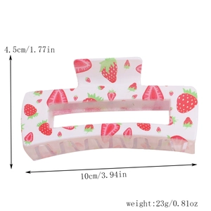Detail view of 10cm strawberry print rectangular hair claw clip with size measurements