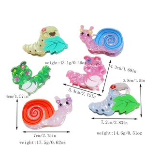 Detailed view of colorful PVC snail and caterpillar hair claws with size and weight dimensions