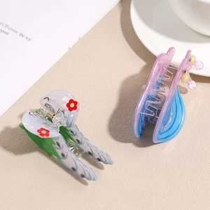 Floral wavy acrylic hair claw clips in translucent pink, blue, and green gradients