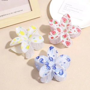 Five-petal flower hair clips with strawberry, lemon, and blueberry fruit patterns