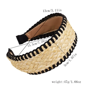 Detail view of woven straw headband with black braided edge and measurement markers