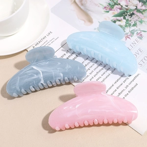 Three-piece acetate marble textured hair claw clips set in blue and pink tones