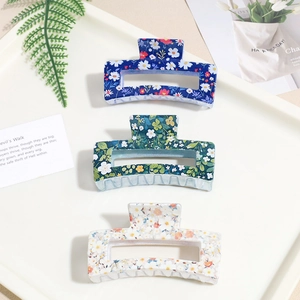 Three-piece set of floral square hair claws in navy blue, dark green, and cream colors