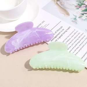 Set of large acetate hair claws with marble pattern in light purple and green