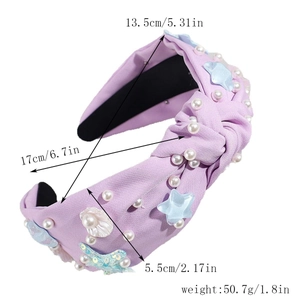 Detail of purple knotted headband with starfish sequins and pearl beads showing size