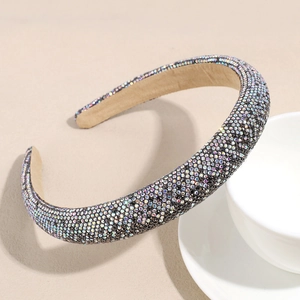 Close-up of sparkling colorful rhinestones on a padded wide headband for women