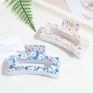 Floral print square hair claw clips set in light blue and cream with daisy patterns