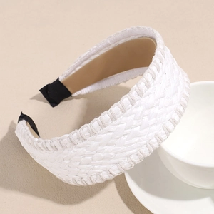 Detail shot of the white woven straw headband featuring a textured cross-braided design