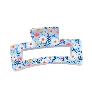 Light blue rectangular floral hair claw with daisy patterns for elegant hair styling