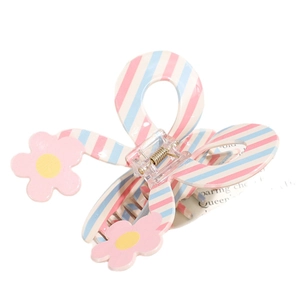 Molla per capelli a righe rosa e blu con decorazioni floreali su sfondo bianco