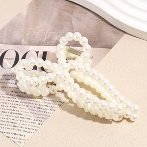 Pince à cheveux élégante avec perles blanches et nœud papillon pour coiffure chic