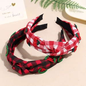 Plaid fabric headbands with fruit embroidery and central knot in red and black colors