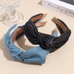 Minimalist denim fabric headband with cross bow design and vintage stitching detail