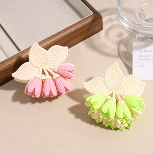 Elegant tulip claw clip with hollow flower design and soft pastel colors hair accessory