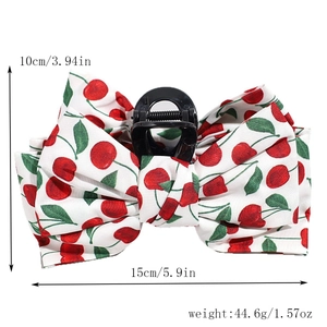 Detail view of large 15cm hair claw clip with cherry pattern bow and size dimensions