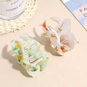 Elegant floral acrylic hair claws with citrus fruit patterns and golden metal spring