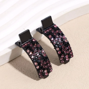 Elegant duckbill hair clips with sparkling pink and black rhinestones on a metal base