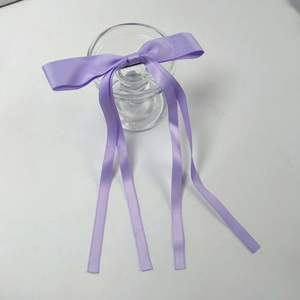 Elegant purple satin bow hair clip with long ribbons for ballet style hairstyles