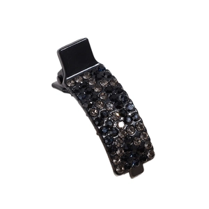 Elegant black rhinestone hair clip with sparkling grey crystals on a polished base