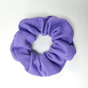 Vibrant purple elastic scrunchie hair tie with soft knitted honeycomb texture for women