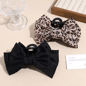 Elegant leopard print and black satin bow hair claw clips for stylish high ponytail buns